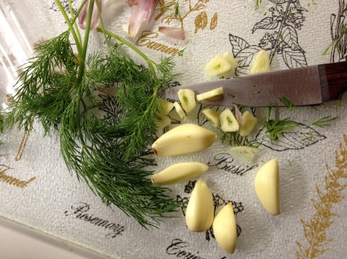 Chopping dill and garlic
